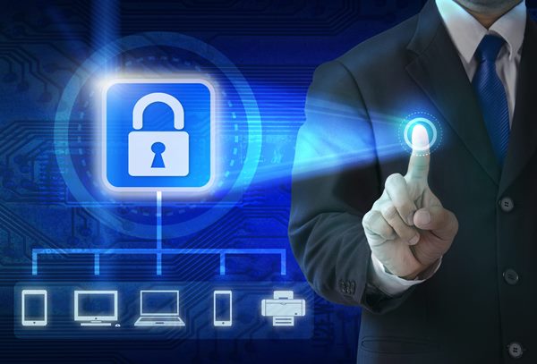 Hand pushing virtual security button on digital background